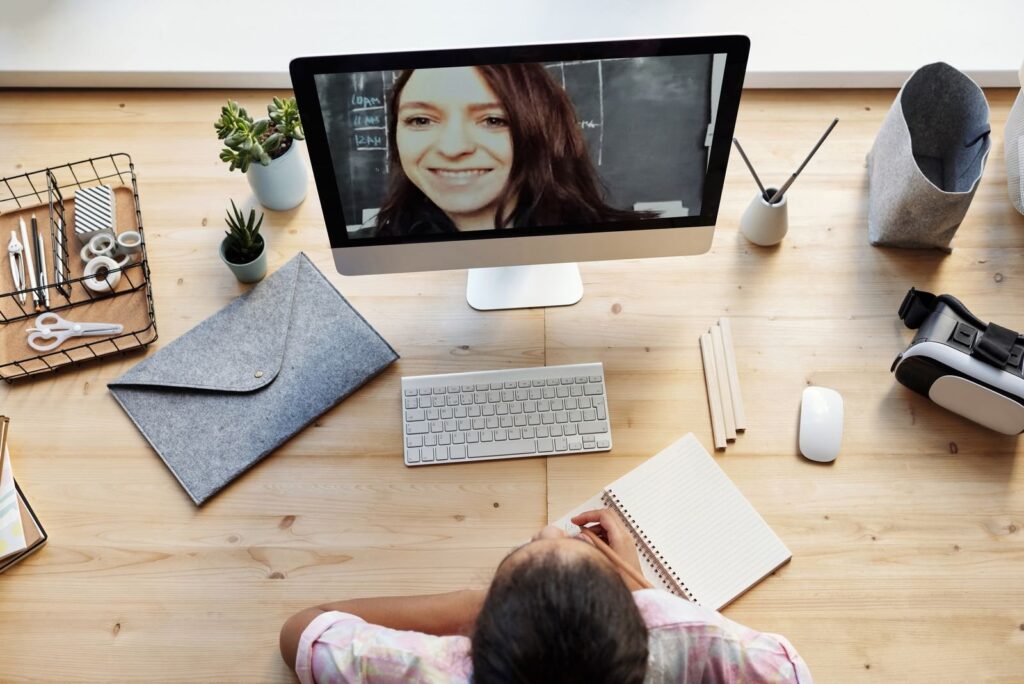 Student having an online maths lesson with a tutor on a video call